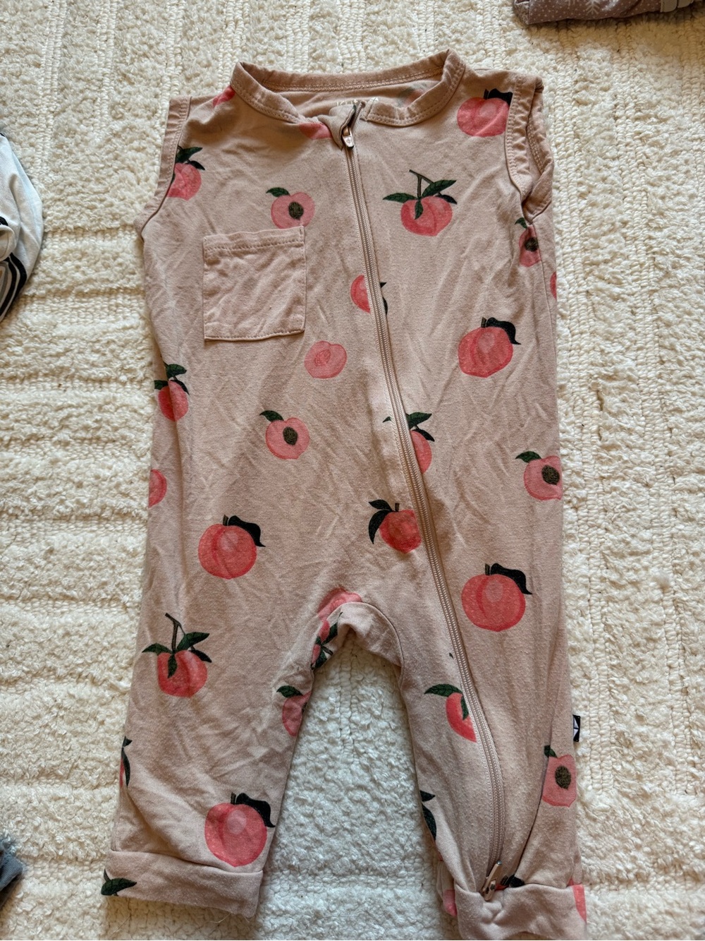 Kyte Baby peach sleeveless zippered romper